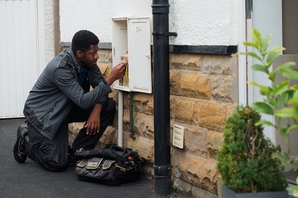 Domestic and General engineer checking the gas meter box