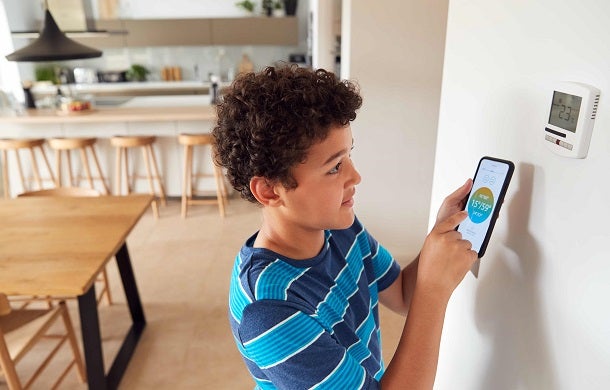 Child using smart thermostat