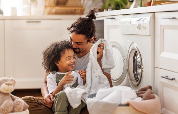 Father and son doing laundry