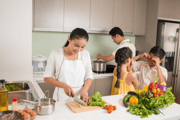 Family in kitchen cooking