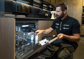 Whirlpool engineer fixing appliance